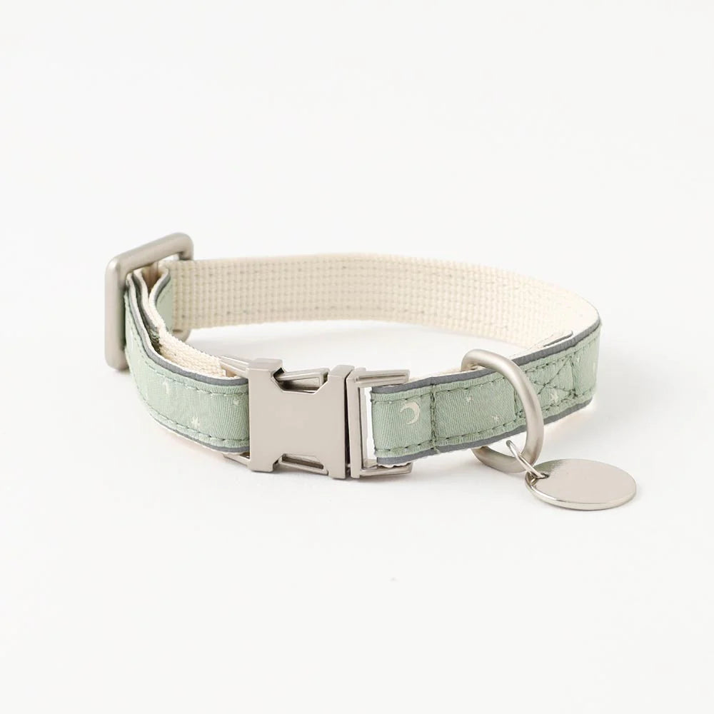 Dog collar with green and beige pattern on a white background